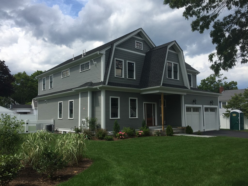 7 Marshall Road Wellesley, MA 02482 - Photo 3 of 29 a front view of a house with a garden