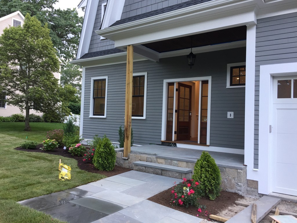 7 Marshall Road Wellesley, MA 02482 - Photo 6 of 29 a front view of a house with a yard