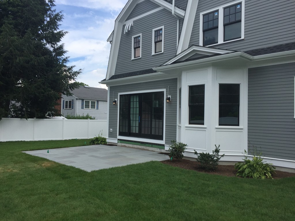 7 Marshall Road Wellesley, MA 02482 - Photo 8 of 29 a front view of a house with a garden and yard