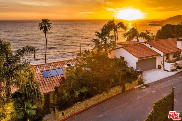 a view of a large body of water and mountain