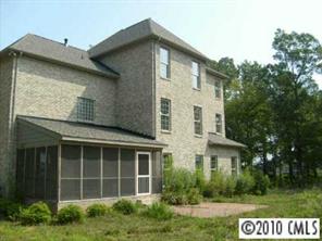 2718 Old Course Road Monroe, NC 28112 - Photo 2 of 8 a view of a house with a yard