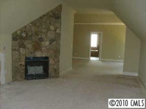 2718 Old Course Road Monroe, NC 28112 - Photo 6 of 8 a view of a livingroom with a fireplace