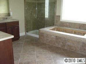2718 Old Course Road Monroe, NC 28112 - Photo 7 of 8 a bathroom with a bathtub and shower