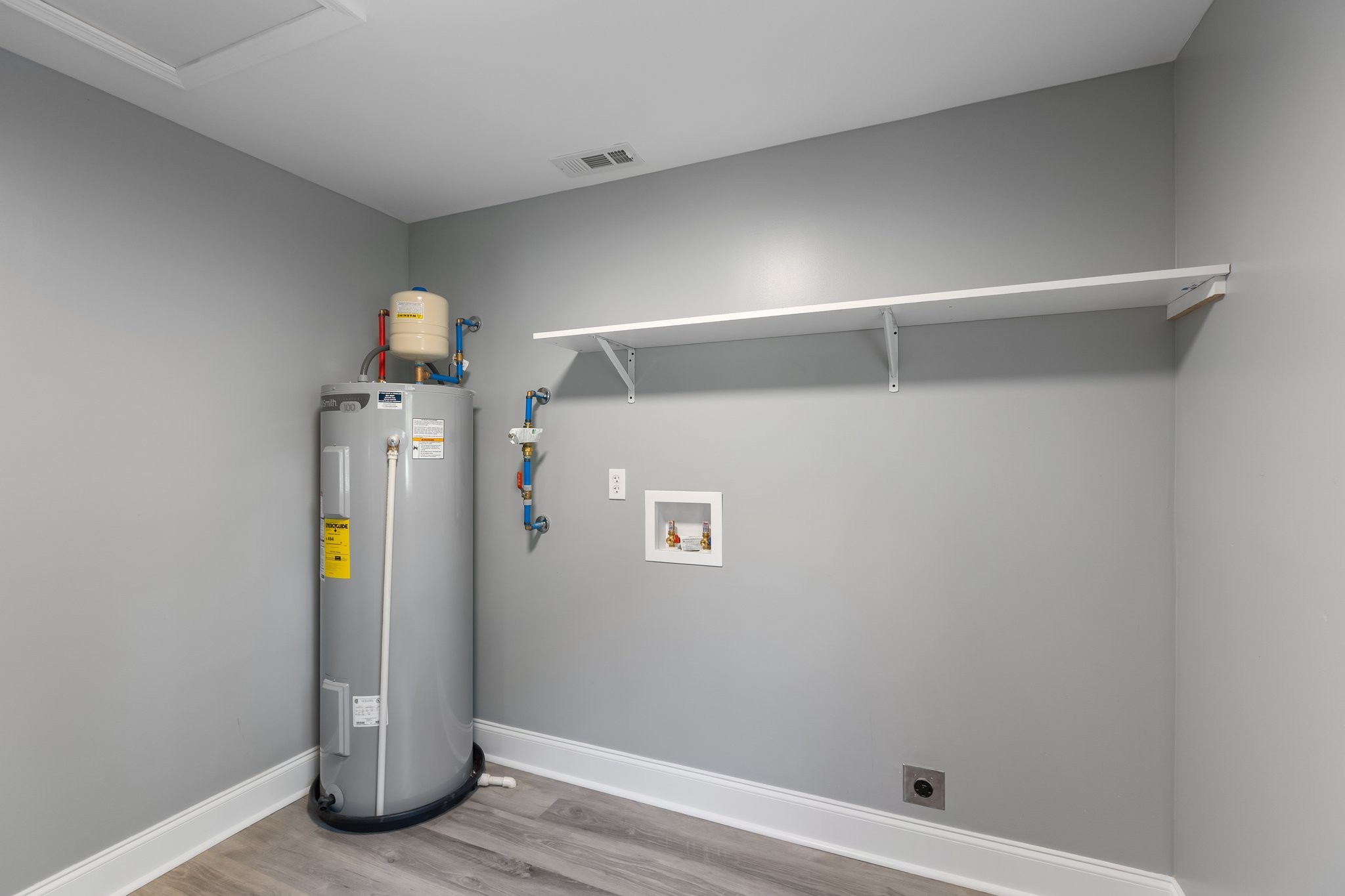 1591 Marsh Creek Road Linden, TN 37096 - Photo 12 of 30 a view of water heater room with wooden floor