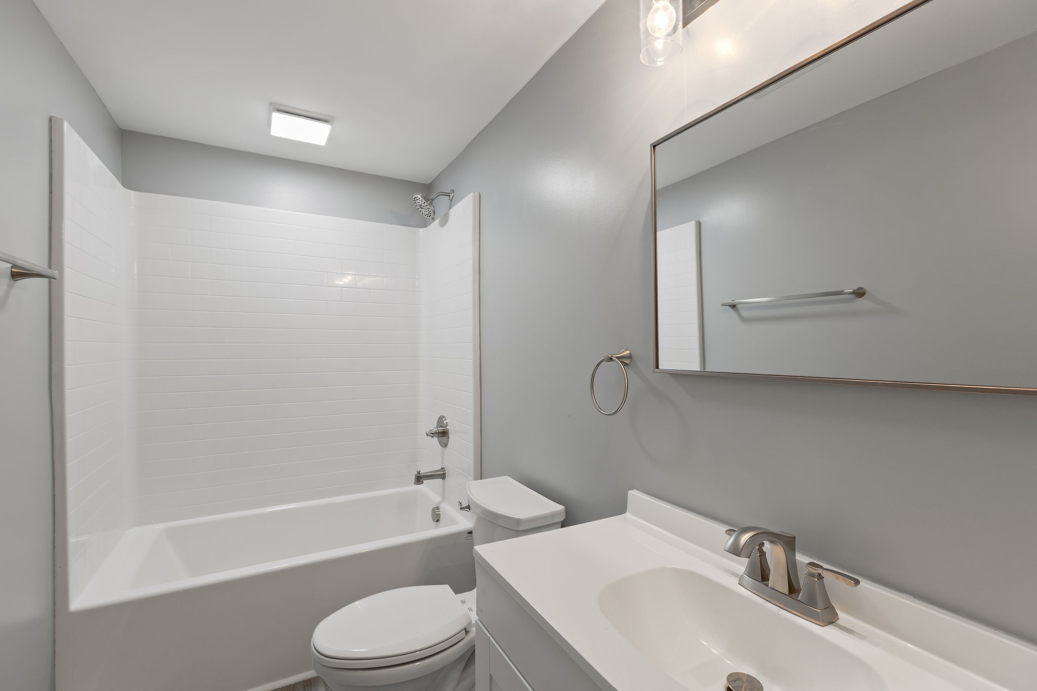 1591 Marsh Creek Road Linden, TN 37096 - Photo 21 of 30 a bathroom with a bathtub shower sink vanity mirror and toilet