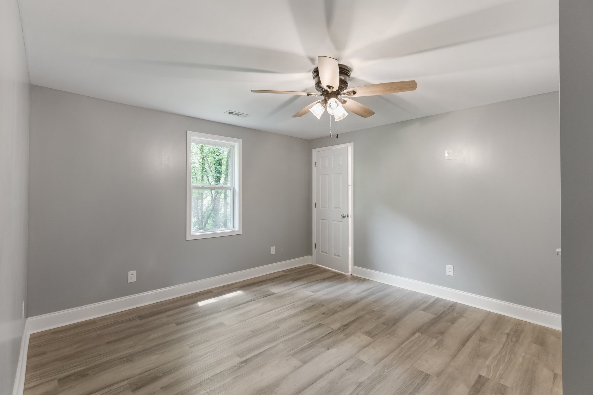 1591 Marsh Creek Road Linden, TN 37096 - Photo 23 of 30 wooden floor in an empty room with a window