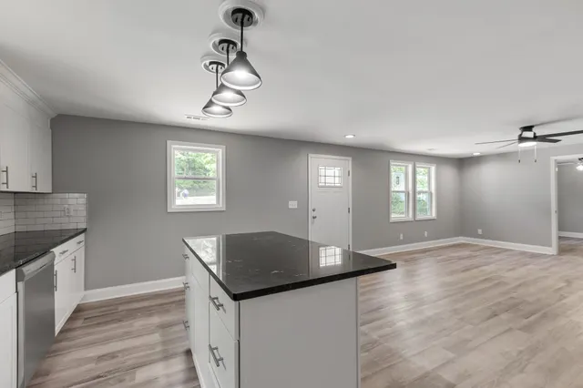 a view of a kitchen and windows