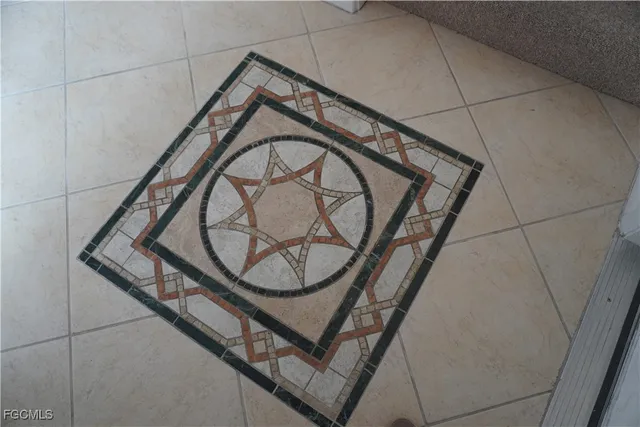 a view of staircase with a metal railing and a sink
