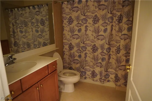 a bathroom with a toilet and a sink