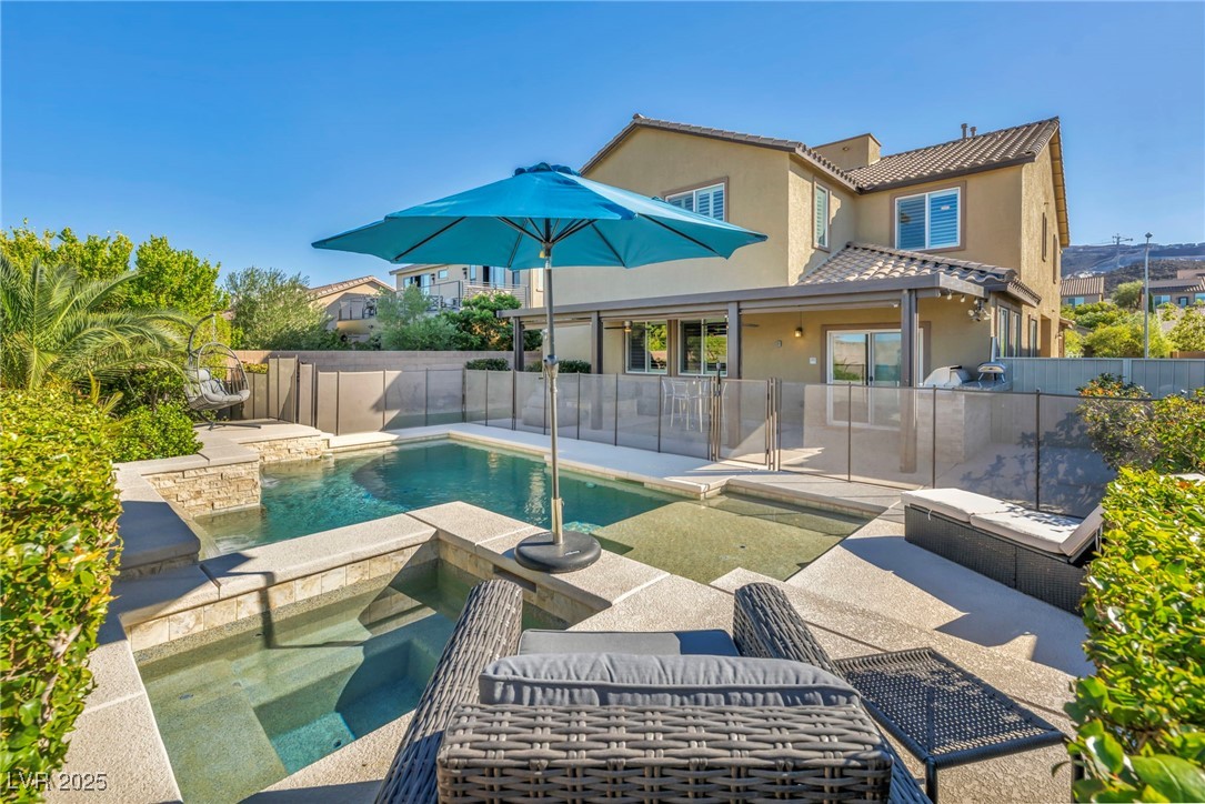 952 McKinley View Avenue Henderson, NV 89012 - Photo 78 of 82 View of pool with an in-ground hot tub, a patio, and a fenced backyard