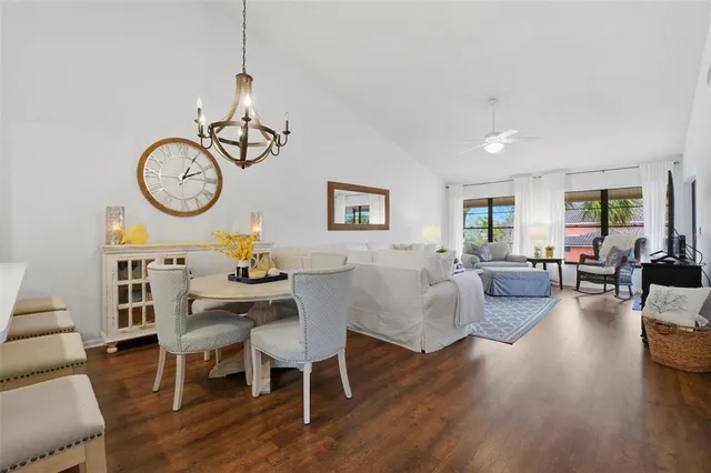 a view of a dining room with furniture wooden floor and a rug
