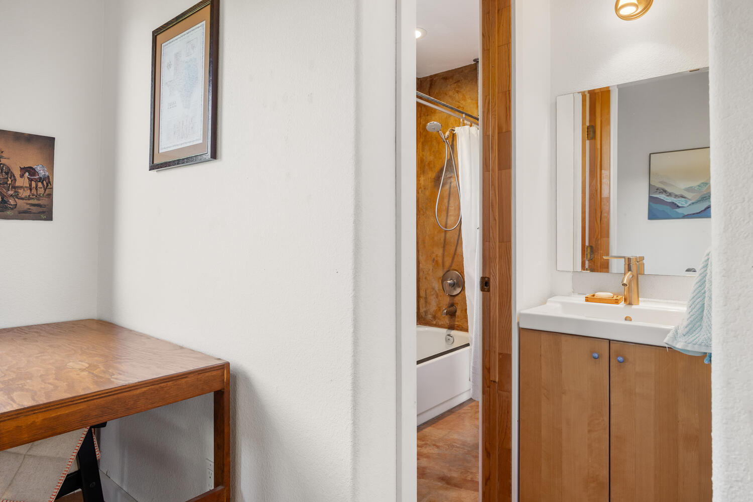 650 Angel Fire Drive Dripping Springs, TX 78620 - Photo 18 of 40 a bathroom with a sink a mirror and a shower