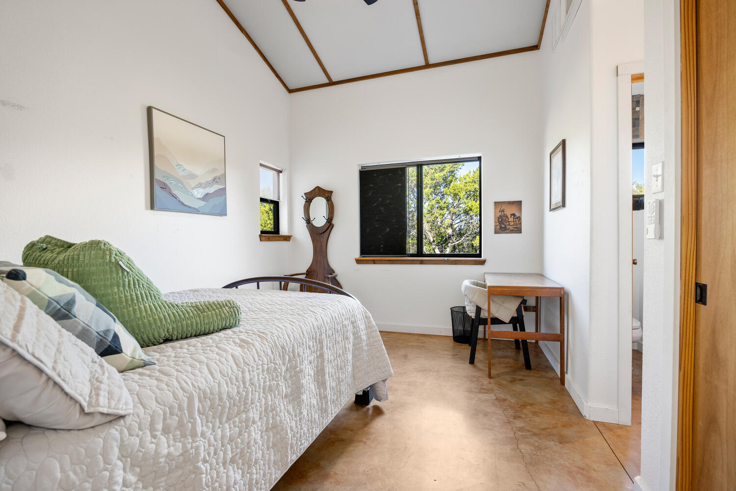 650 Angel Fire Drive Dripping Springs, TX 78620 - Photo 20 of 40 a bedroom with a bed and a table in it