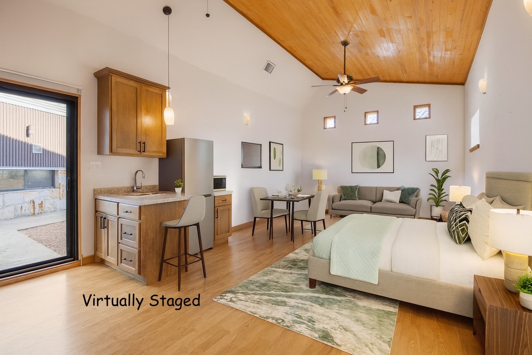 650 Angel Fire Drive Dripping Springs, TX 78620 - Photo 23 of 40 a living room with furniture a rug and white walls