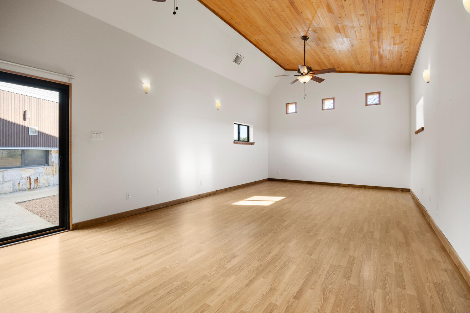 650 Angel Fire Drive Dripping Springs, TX 78620 - Photo 26 of 40 an empty room with wooden floor and windows