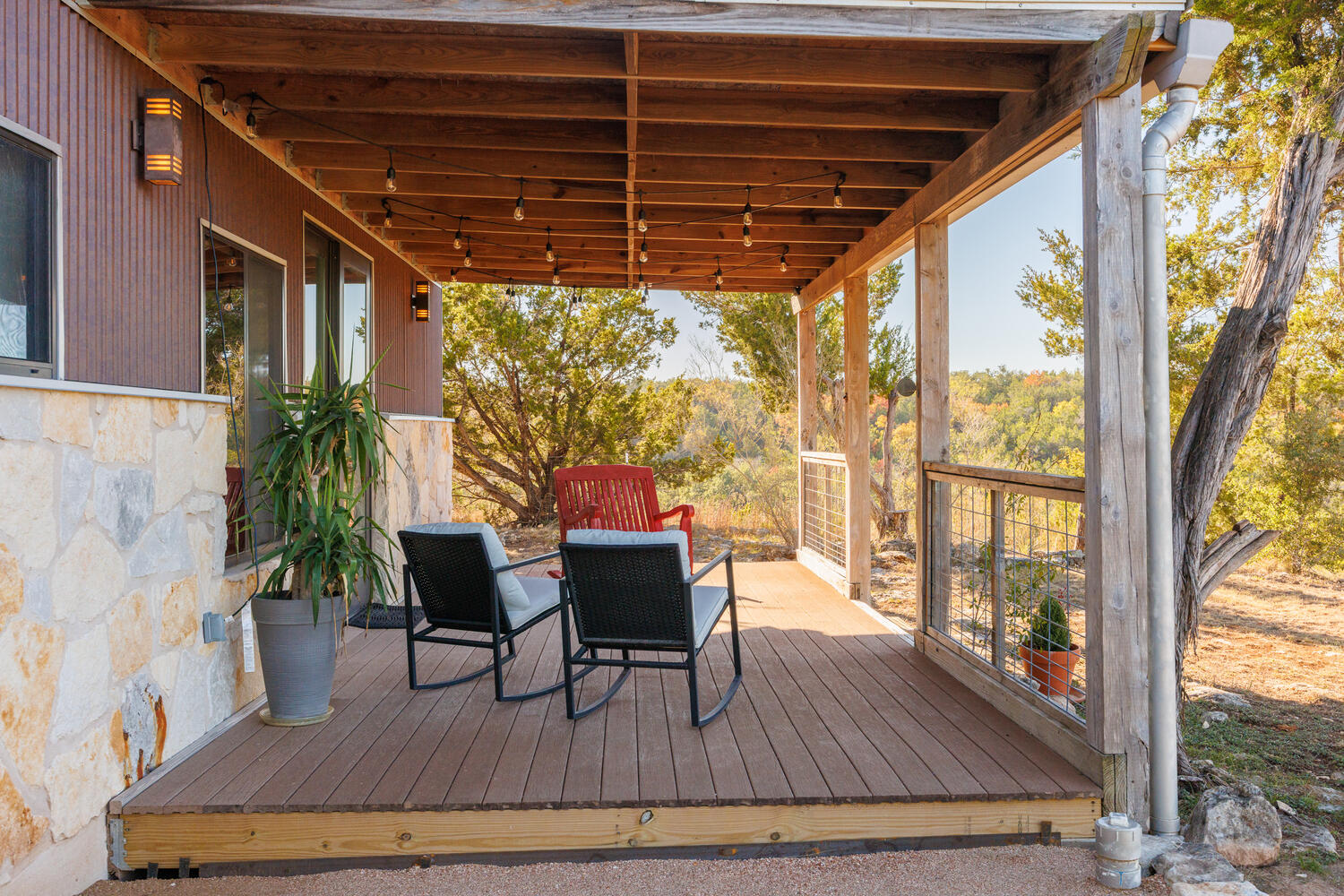 650 Angel Fire Drive Dripping Springs, TX 78620 - Photo 31 of 40 a view of a porch with furniture and wooden floor