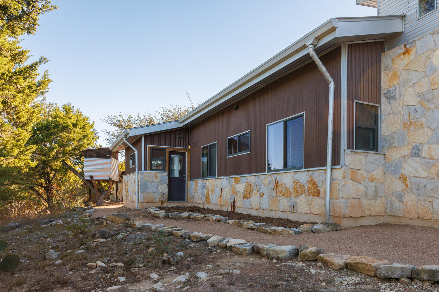 650 Angel Fire Drive Dripping Springs, TX 78620 - Photo 32 of 40 a front view of a house with a yard