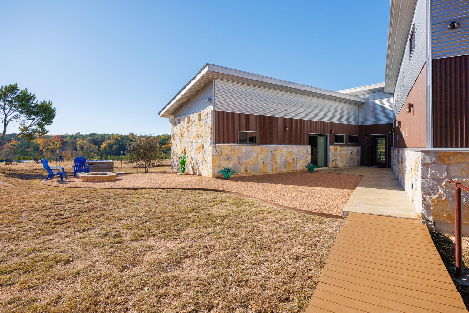 650 Angel Fire Drive Dripping Springs, TX 78620 - Photo 4 of 40 Texas stone and Rust look Corrugated siding