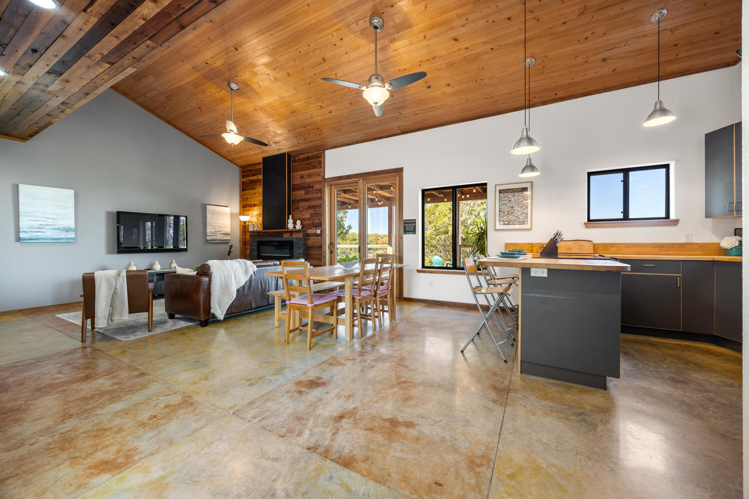 650 Angel Fire Drive Dripping Springs, TX 78620 - Photo 6 of 40 a living room with furniture a dining table and chairs with wooden floor