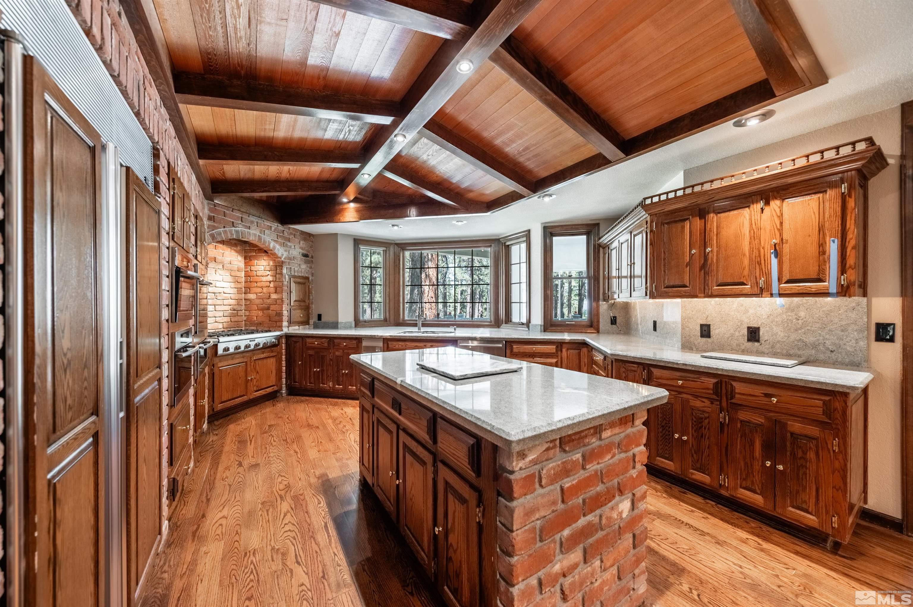 7250 Franktown Road Washoe Valley, NV 89704 - Photo 12 of 40 a kitchen with a stove sink and cabinets