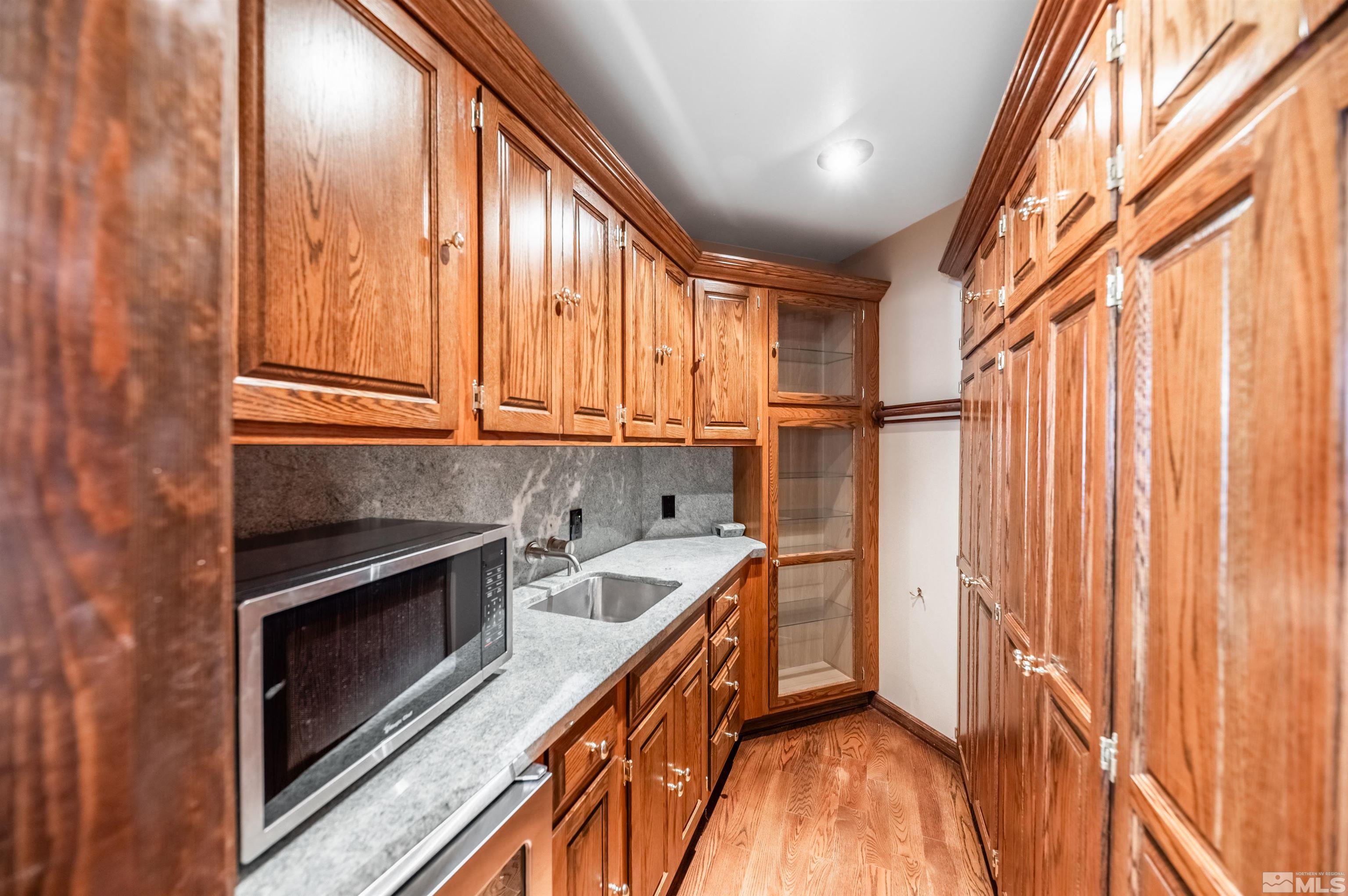7250 Franktown Road Washoe Valley, NV 89704 - Photo 15 of 40 a kitchen with a refrigerator and a window