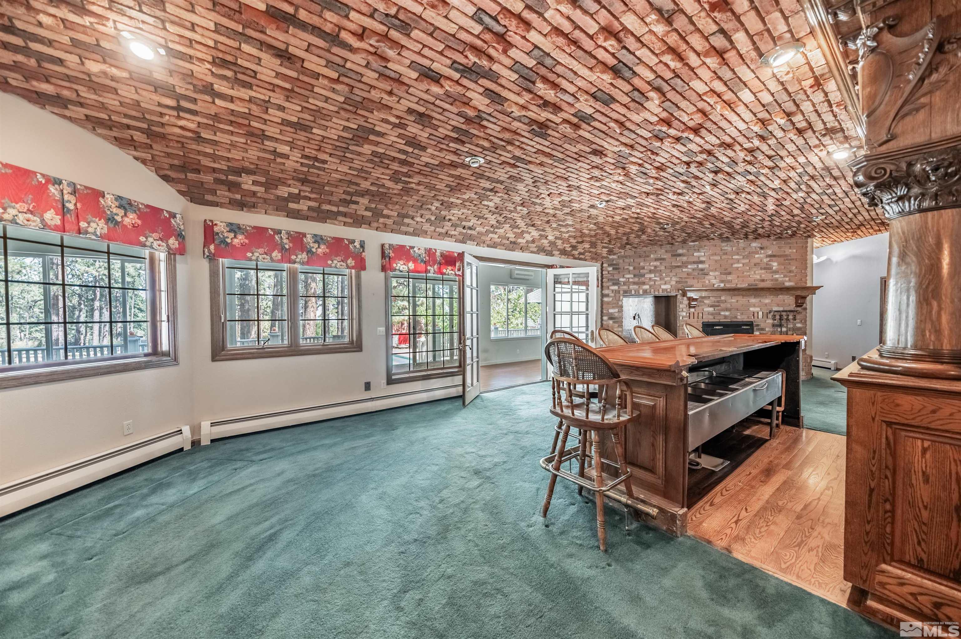 7250 Franktown Road Washoe Valley, NV 89704 - Photo 16 of 40 a balcony with furniture and stove