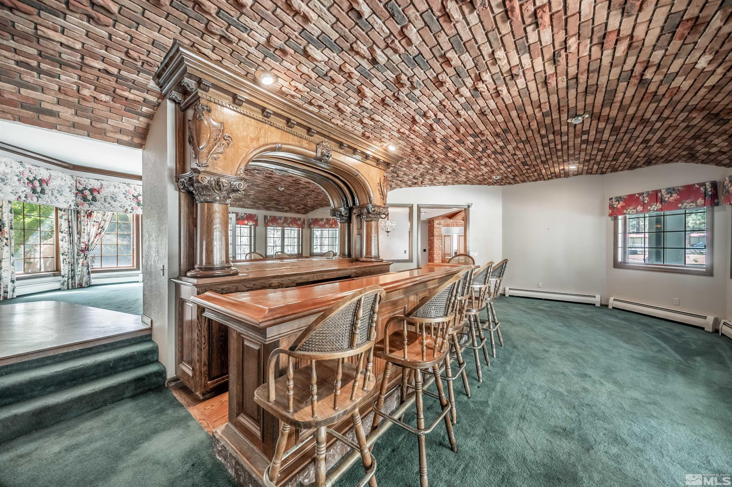 7250 Franktown Road Washoe Valley, NV 89704 - Photo 17 of 40 a roof deck with table and chairs