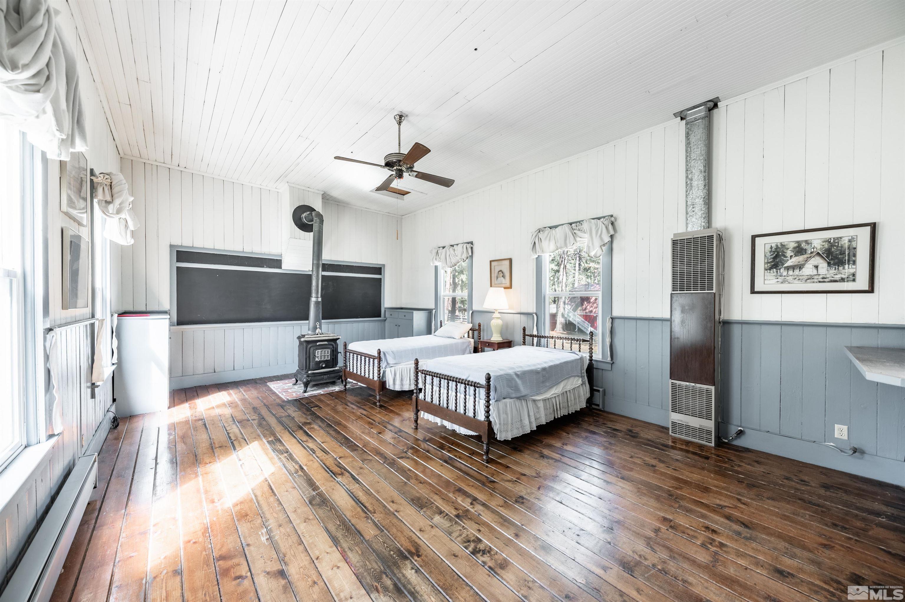 7250 Franktown Road Washoe Valley, NV 89704 - Photo 33 of 40 a living room with furniture and a flat screen tv