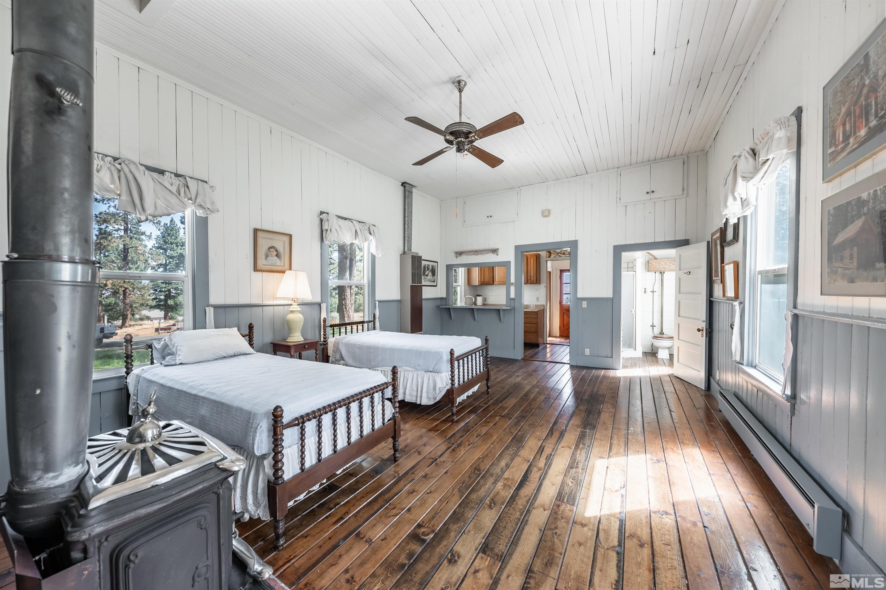 7250 Franktown Road Washoe Valley, NV 89704 - Photo 34 of 40 a spacious bedroom with two beds and a large window