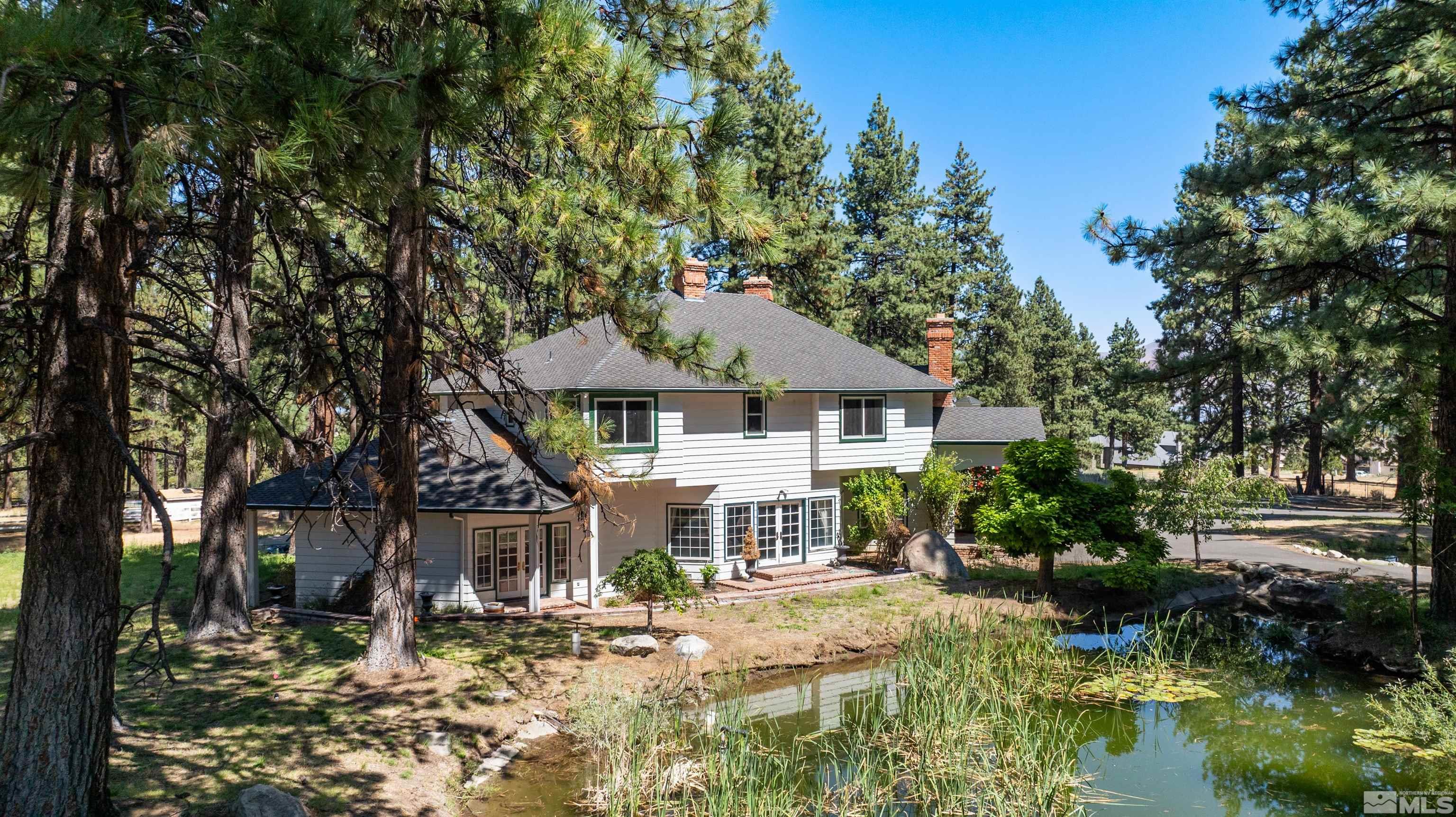 7250 Franktown Road Washoe Valley, NV 89704 - Photo 4 of 40 a front view of a house with a yard