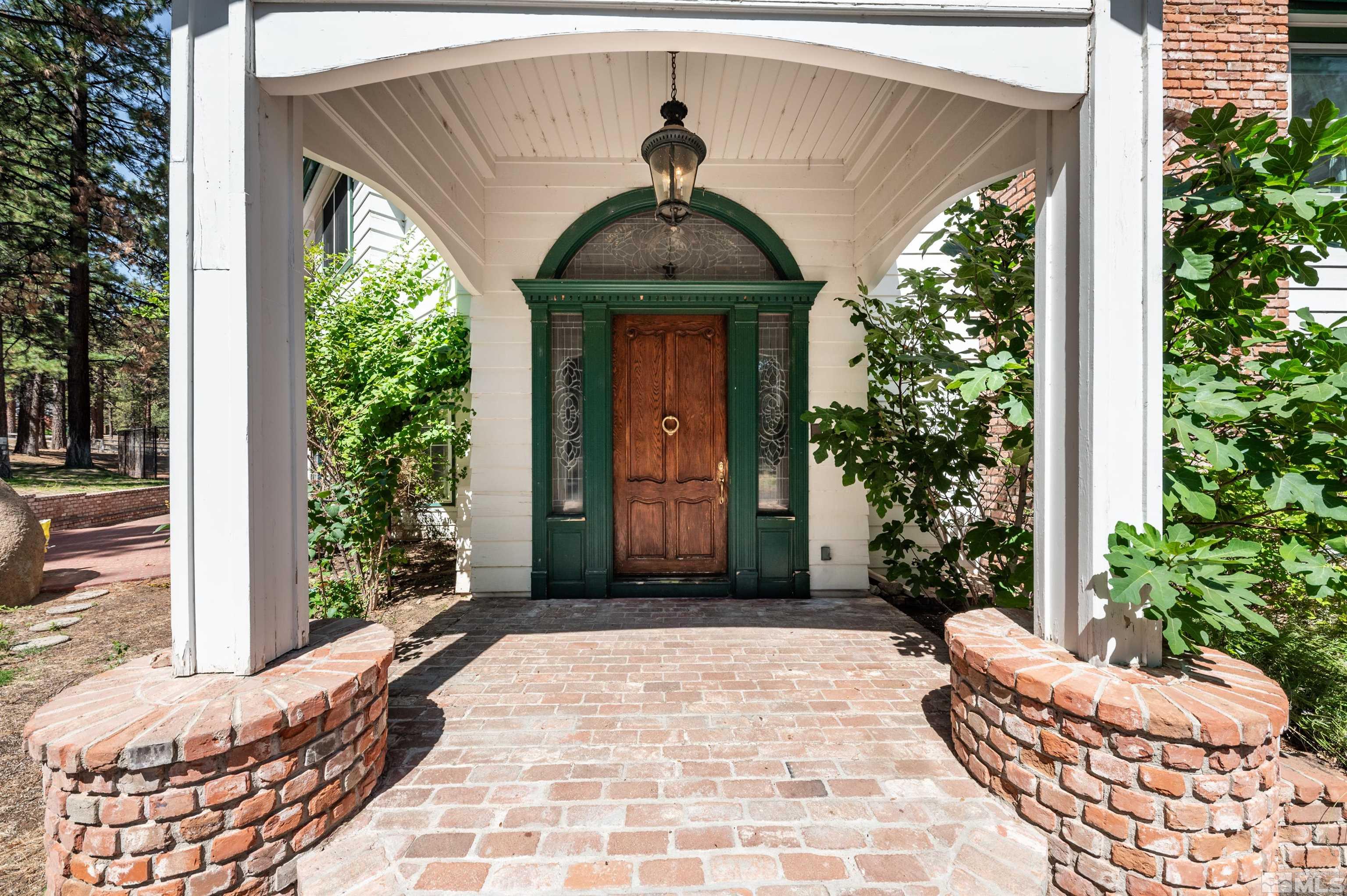 7250 Franktown Road Washoe Valley, NV 89704 - Photo 6 of 40 a front view of a house with garden