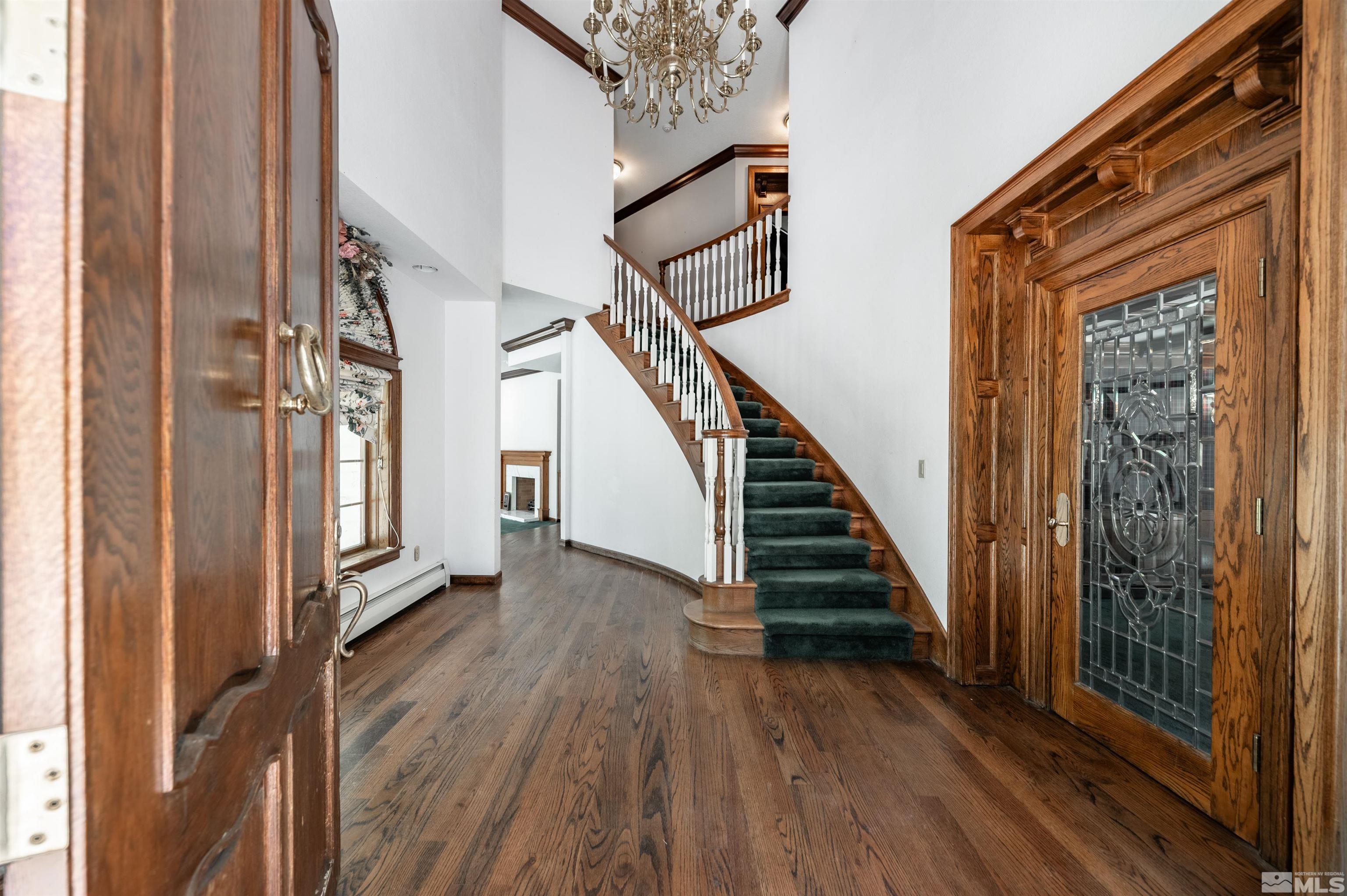 7250 Franktown Road Washoe Valley, NV 89704 - Photo 7 of 40 a view of a hallway with wooden floor and staircase
