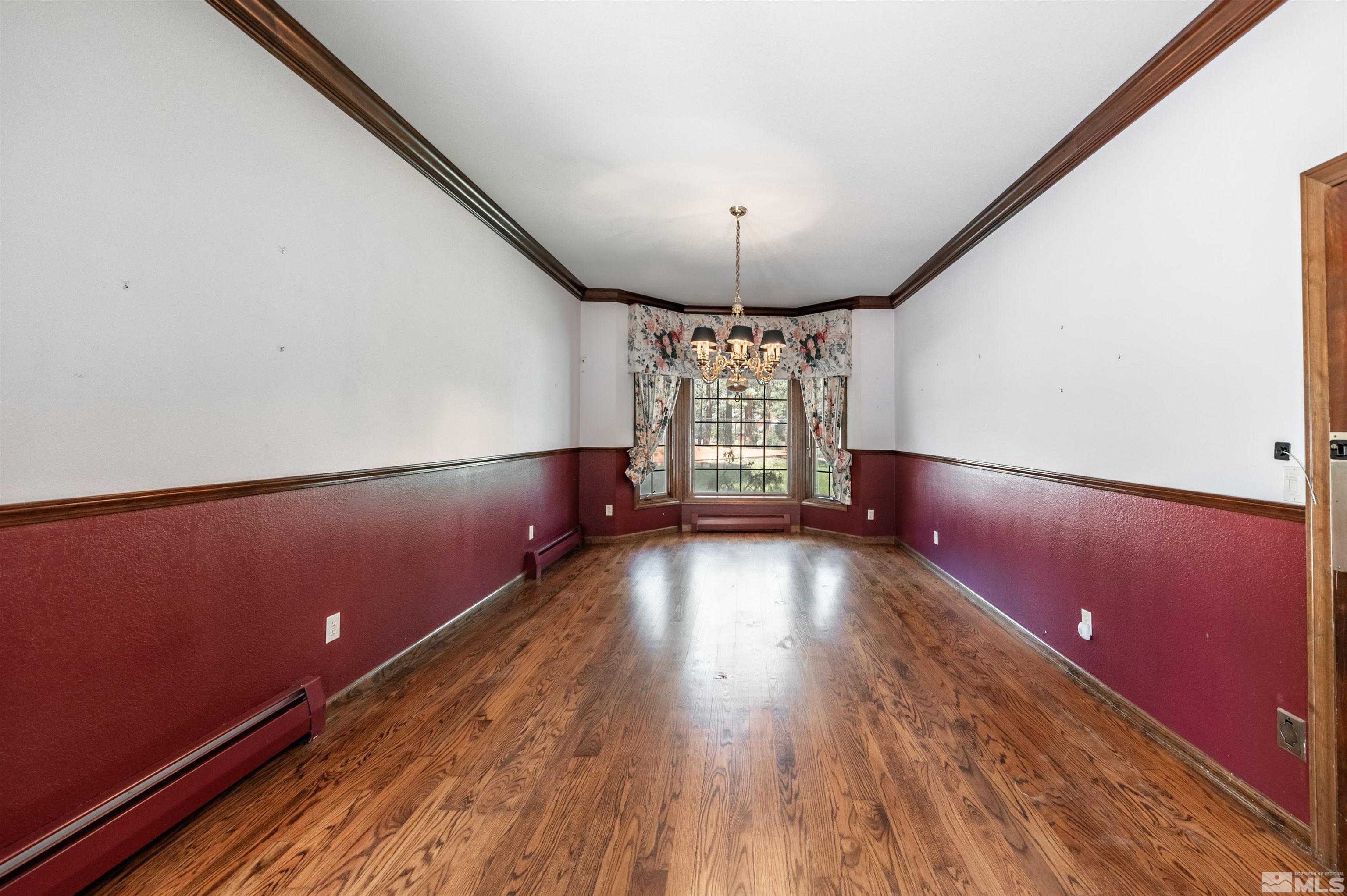 7250 Franktown Road Washoe Valley, NV 89704 - Photo 10 of 40 a view of empty room with wooden floor