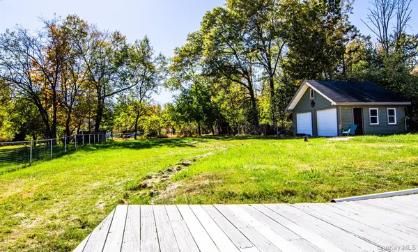 a house view with swimming pool in front of it