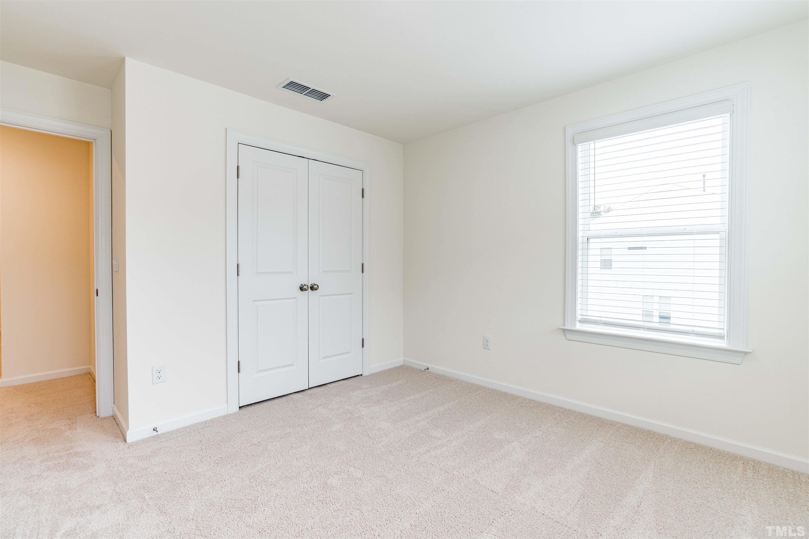 6936 Leesville Road Raleigh, NC 27613 - Photo 21 of 32 an empty room with windows