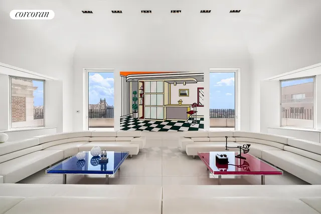 a living room with furniture and floor to ceiling windows