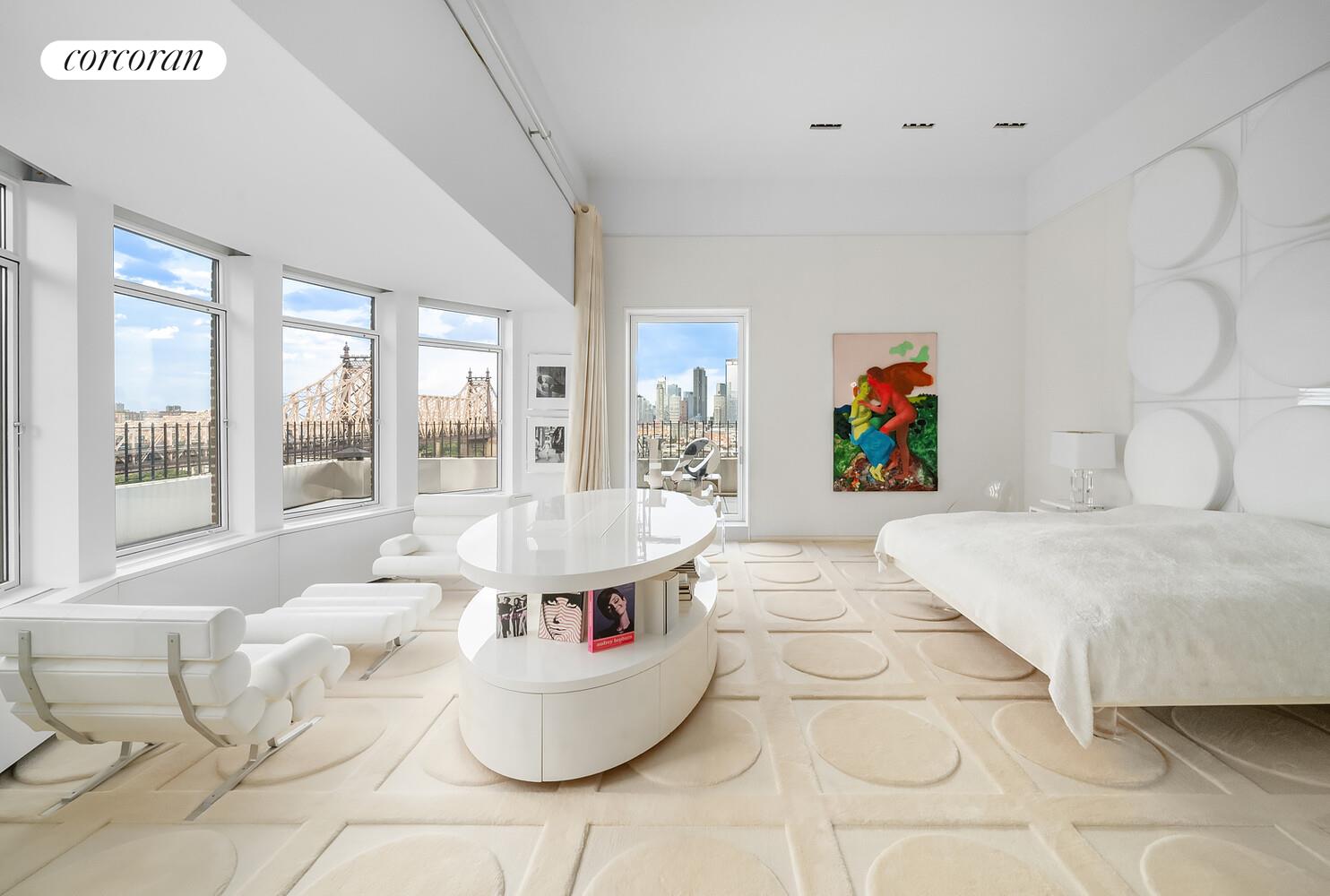 1 Sutton Place South, Unit PH Manhattan, NY 10022 - Photo 12 of 26 a living room with furniture and large windows