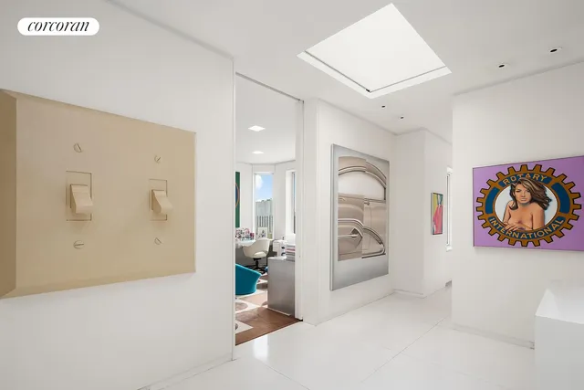 a bedroom with a bed next to a large window