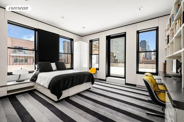 a bedroom with furniture and a bed