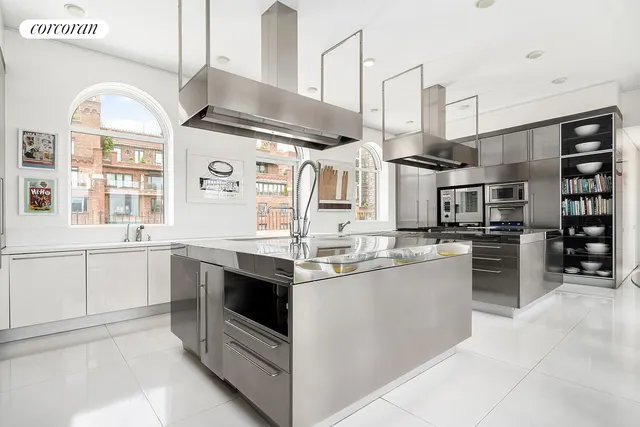 a kitchen with stainless steel appliances granite countertop a sink and stove
