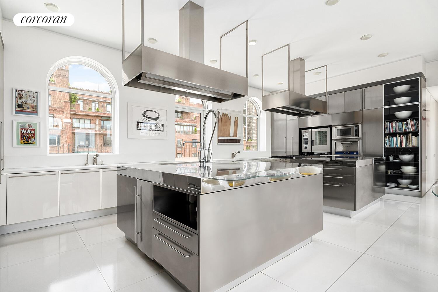 1 Sutton Place South, Unit PH Manhattan, NY 10022 - Photo 4 of 26 a kitchen with stainless steel appliances granite countertop a sink and stove