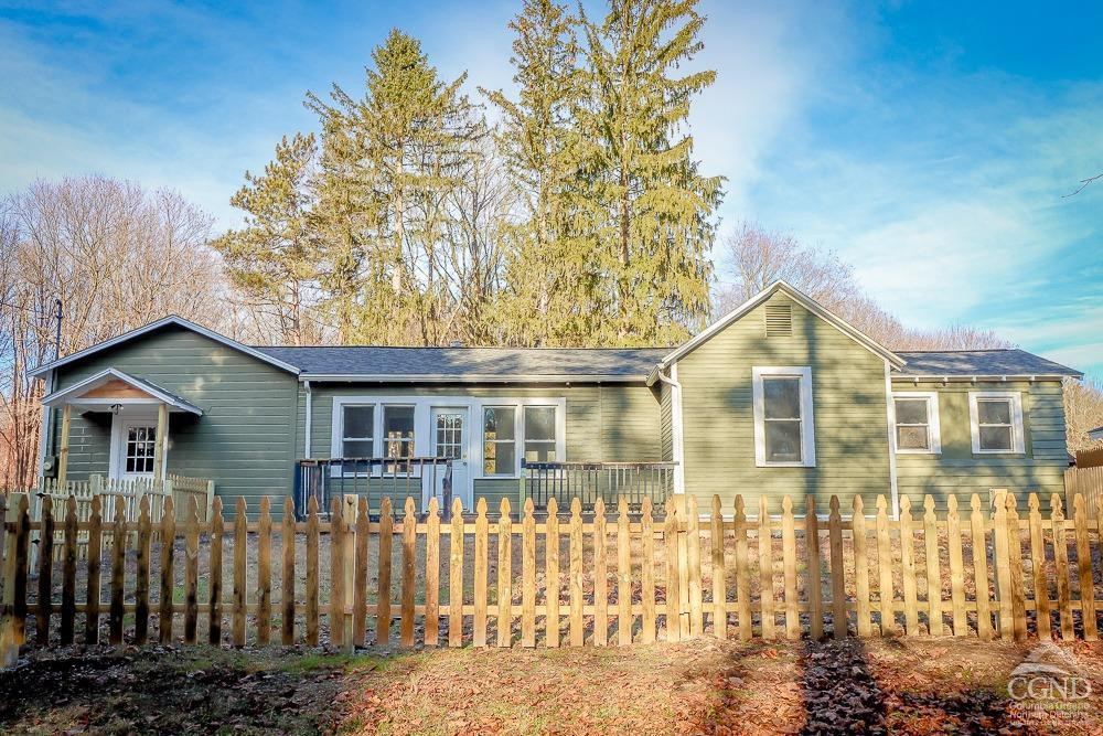 101 Orinsekwa Road Valatie, NY 12184 - Photo 1 of 23 a front view of a house with a garden