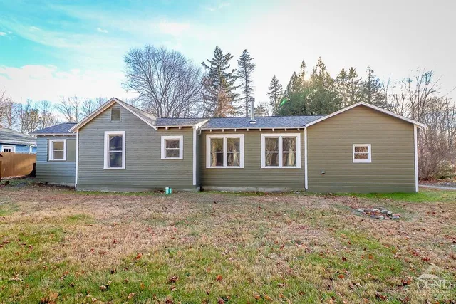 a view of a house with a yard