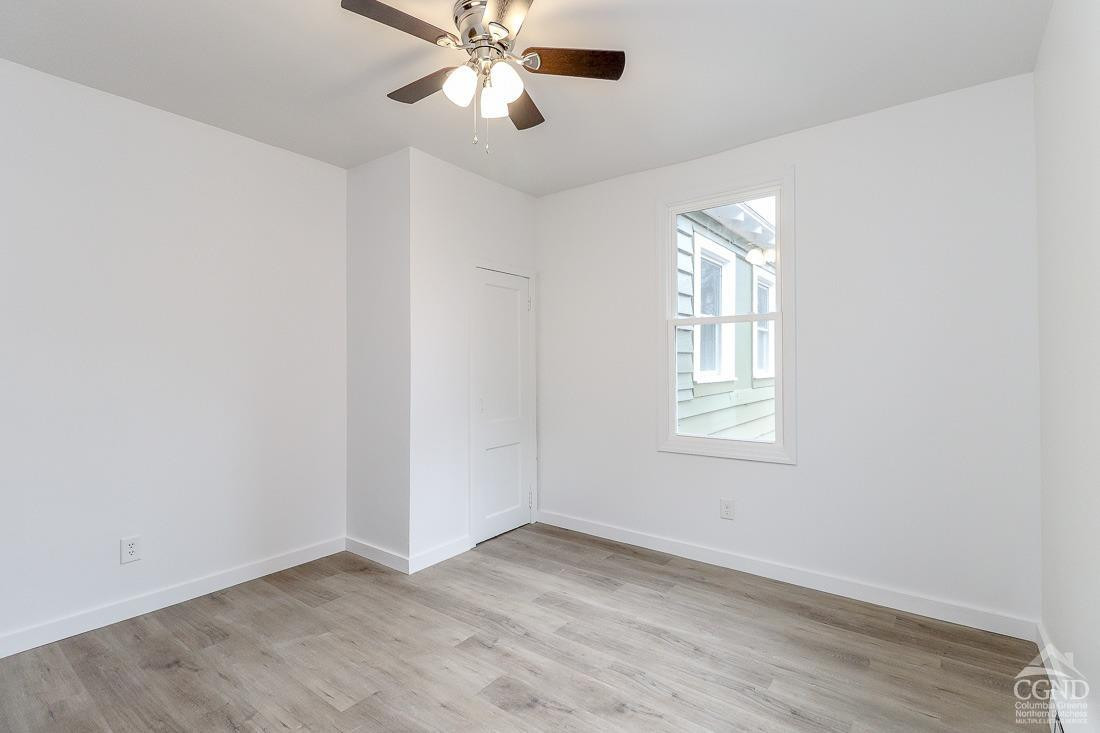 101 Orinsekwa Road Valatie, NY 12184 - Photo 10 of 23 an empty room with windows and fan