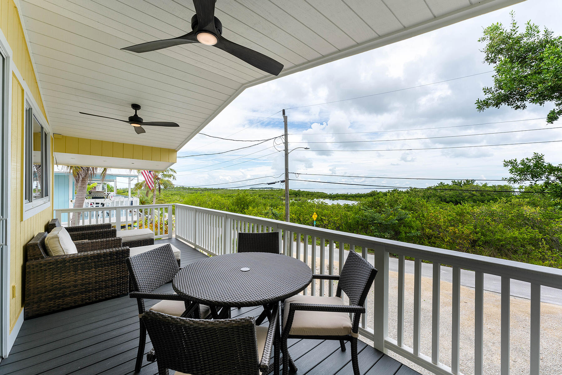102 South Drive Key Largo, FL 33037 - Photo 16 of 26 a view of a balcony with furniture