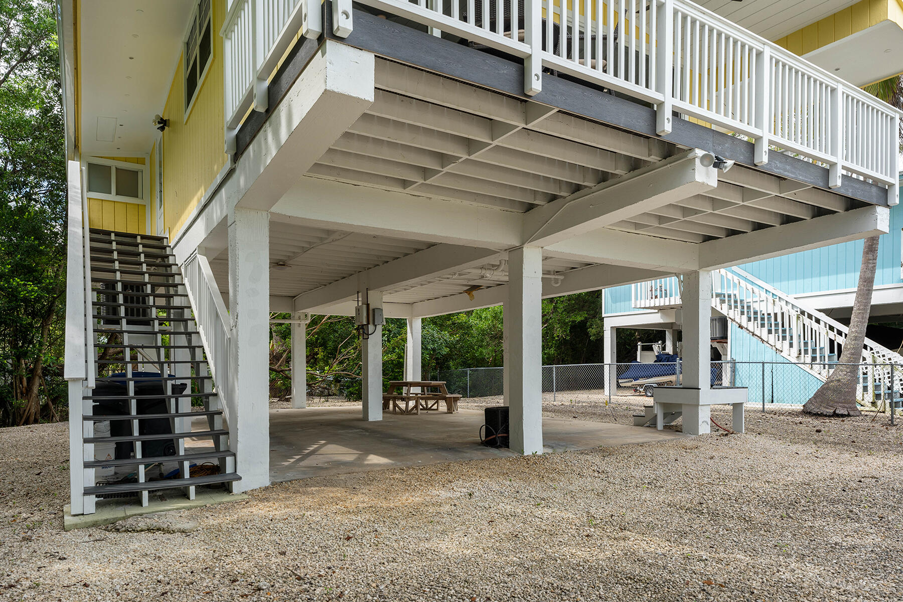 102 South Drive Key Largo, FL 33037 - Photo 20 of 26 a view of a house with porch and wooden stairs