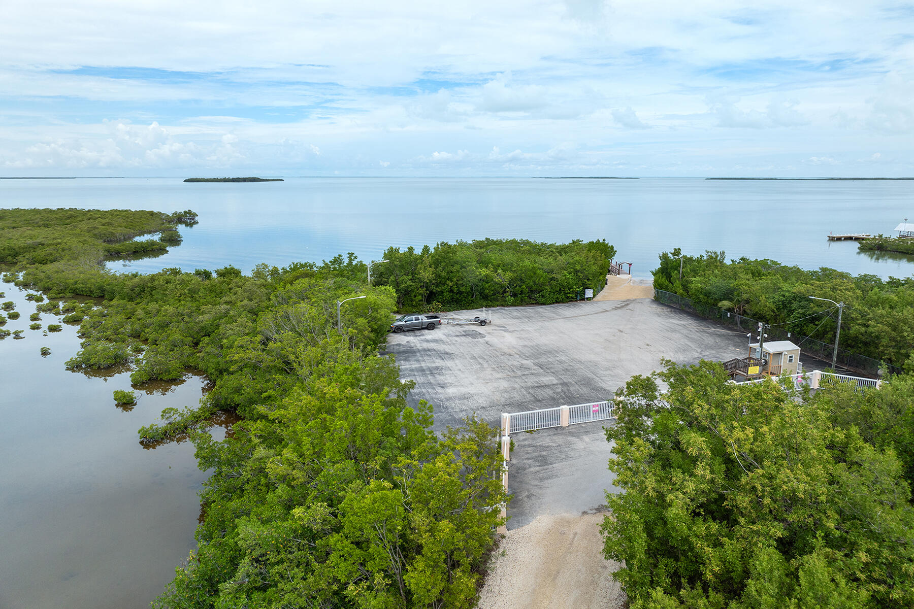 102 South Drive Key Largo, FL 33037 - Photo 24 of 26 a view of a lake with a building in back