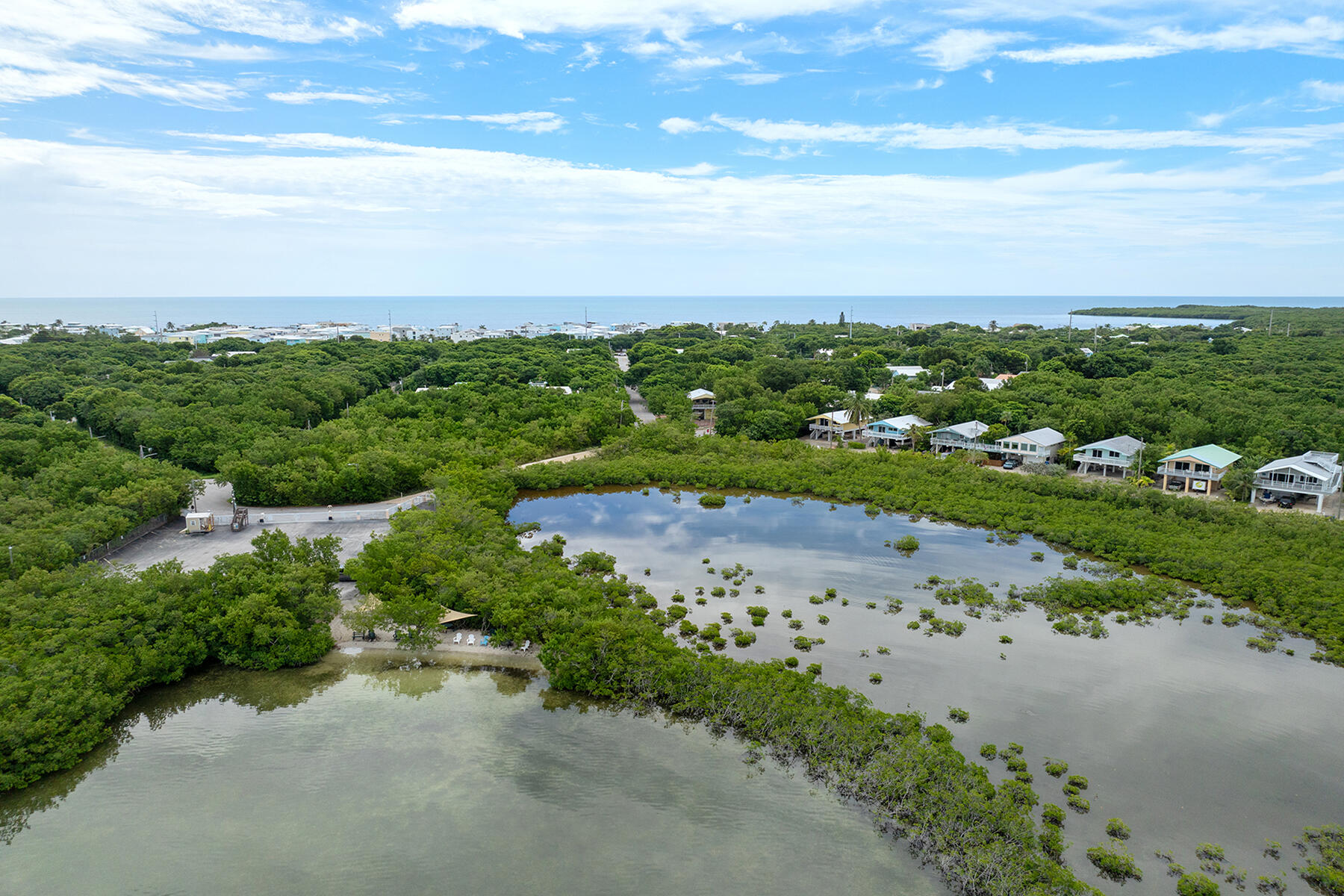 102 South Drive Key Largo, FL 33037 - Photo 26 of 26 a view of a pathway both side of grassy field with ocean view