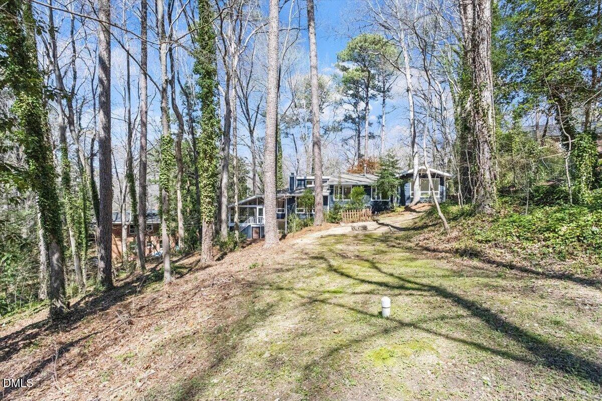 4805 Rembert Drive Raleigh, NC 27612 - Photo 40 of 45 a street view with large trees