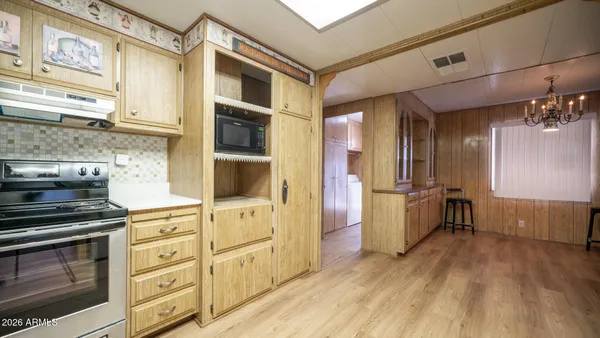 a kitchen with stainless steel appliances a stove and a refrigerator